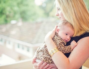 Lisa Abramson and her firstborn child, Lucy, in 2014. A few weeks after Lucy's birth, Abramson started feeling confused, and then started developing delusions — symptoms of postpartum psychosis. (Courtesy of Claire Mulkey)