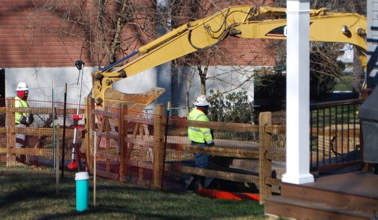 Crews worked on Monday Jan. 21 to stabilize a new sinkhole that opened up at Lisa Drive, a suburban development in West Whiteland Township, Chester County where Sunoco operates its Mariner East pipelines. (Jon Hurdle / StateImpact Pennsylvania)