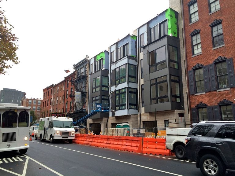 Single-family houses with ground floor garages recently rose on the 200 block of Arch Street. (Ashley Hahn/PlanPhilly)