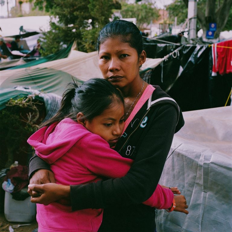 Karen Paz hugs her daughter, Liliana Saray, 9. They are from San Pedro Sula, Honduras. 