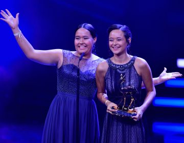 Teenage sisters Melati and Isabel Wijsen of Bali have received many honors for their efforts to ban plastic bags. Above: They accept the 2017 