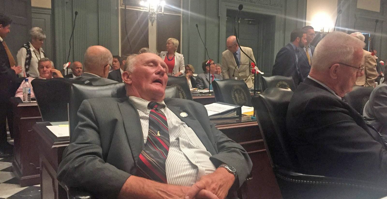 State Rep. Dave Wilson has eyes closed, appears to be sleeping in a late-night legislative session.