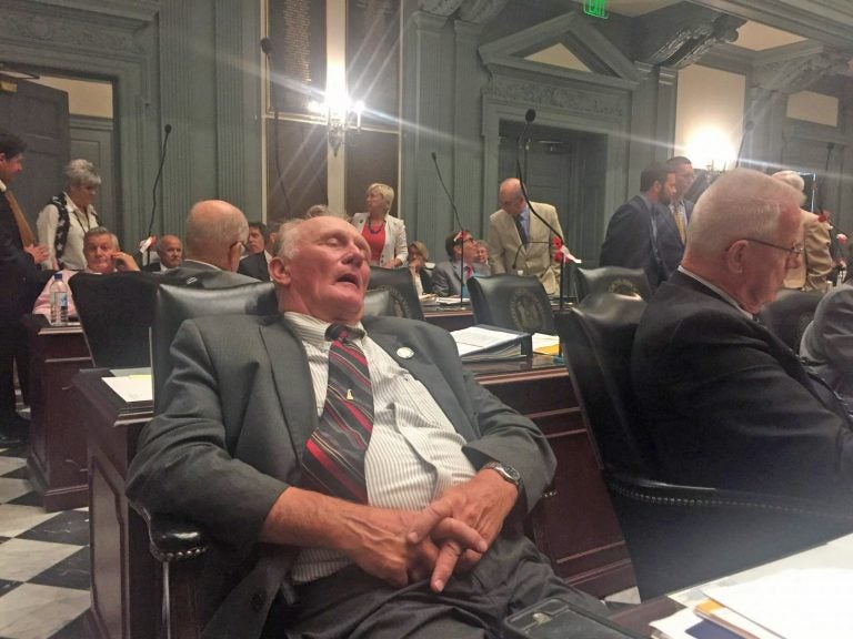 State Rep. Dave Wilson has eyes closed, appears to be sleeping in a late-night legislative session.