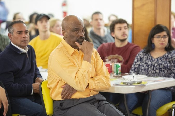 Attendees listen to panelists at Uneven Play: A Community Dinner and Conversation. (Jonathan Wilson for WHYY)