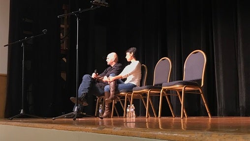 Fetterman onstage with Patty Kim, the Democrat who represents Harrisburg in the state House. (Katie Meyer/WITF)