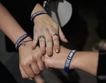 Students who attended Scott Fried's program wear bracelets given to them by Fried that read, 