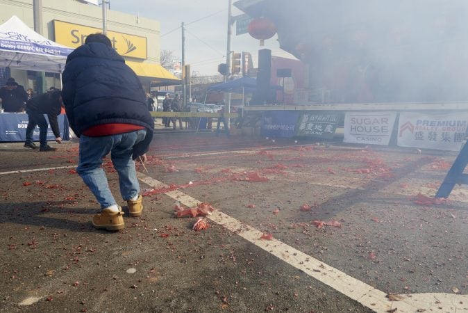 Rows of firecrackers are lit simultaneously at the 2019 Chinese New Year Festival in Northeast Philadelphia. (Natalie Piserchio for WHYY)