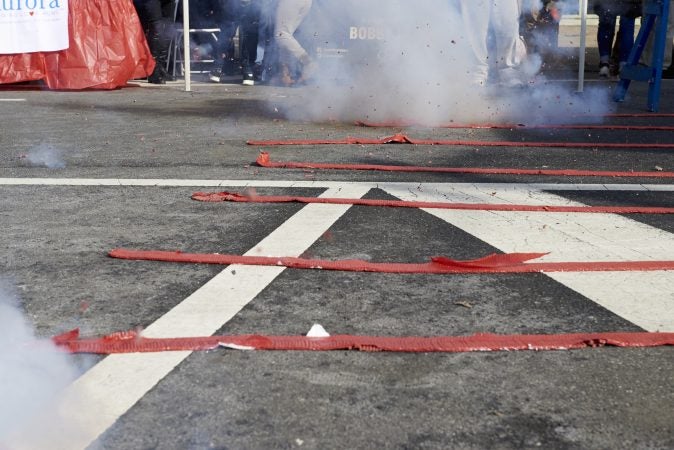 Rows of firecrackers are lit simultaneously at the 2019 Chinese New Year Festival in Northeast Philadelphia. (Natalie Piserchio for WHYY)