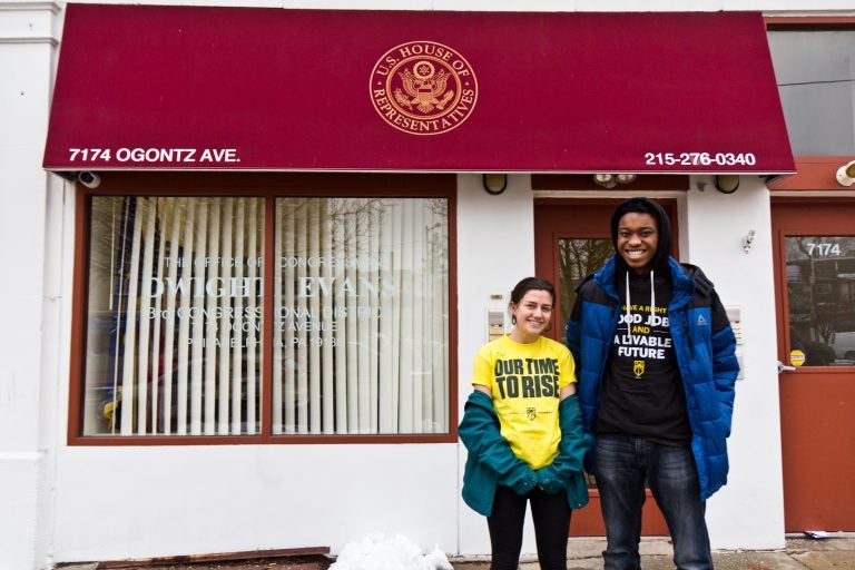 New Sunrise Movement student activists Abby Leddy (left) and Xavier Thomas outside Congressman Dwight Evan’s office. They spoke to him about his supporting the Green New Deal. (Kimberly Paynter/WHYY)