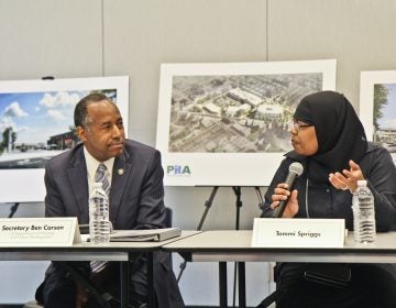 Tommi Spriggs tells her story to Ben Carson, the U.S. Secretary of Housing and Urban Development. (Kimberly Paynter/WHYY)