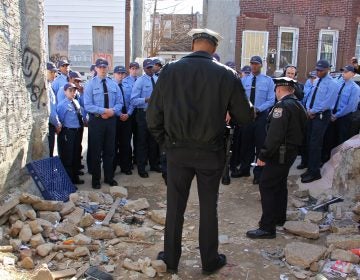 A group of Philadelphia police cadets, touring drug torn Kensington, gather at a vacant lot on East Lippincott Street where their instructors show them signs that heroin is being used there.