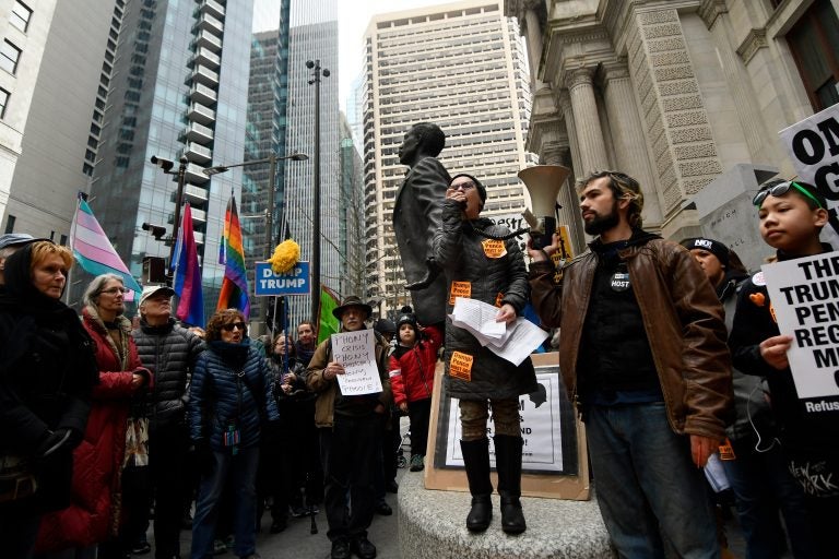 Sam Goldman, national organizer with Refuse Fascism speaks during a Presidents Day protest rally, at City Hall, on Monday. (Bastiaan Slabbers for WHYY)