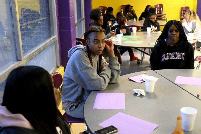 Members of the girls basketball team from MLK and Lankenau High Schools which is coached by Lurline Jones, gather for an end-of-year banquet hosted by coach Lurline Jones, at the cafeteria of MLK HS, in Northwest Philadelphia, Pa., on February 19, 2019. (Bastiaan Slabbers for WHYY)