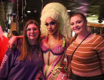 Ariel Versace fans Andie Boberick (left) and Nicole Smyth (right) celebrate their idol's debut on the 11th season of RuPaul's Drag Race during a watch party at Vera Bar & Grill in Cherry Hill.