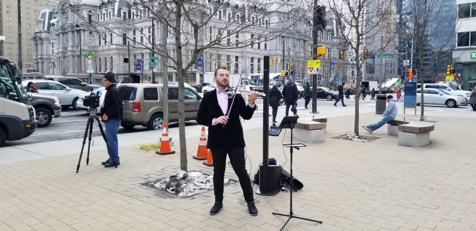 A violinist entertains visitors at LOVE park. (Tom MacDonald/WHYY)