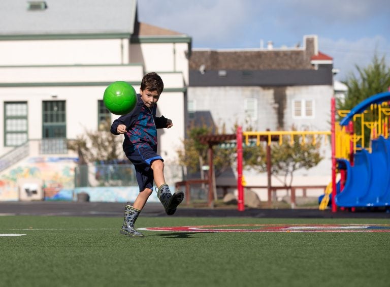 Andres Hassan, 7, plays in the yard of the Sanchez Elementary School in San Francisco, Calif. (Lisa Hornak/For WHYY)