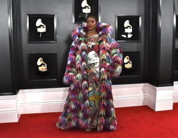 Tierra Whack arrives at the 61st annual Grammy Awards at the Staples Center in Los Angeles last Sunday. She's wearing a coat designed by Nancy Volpe Beringer of Philadelphia and a dress with images painted by Liz Goldberg, a Philadelphia artist. (Photo by Jordan Strauss/Invision/AP)