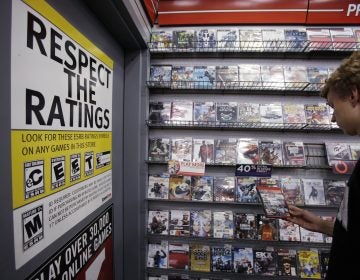 Jack Schooner, 16, looks at Grand Theft Auto video game at GameStop in Palo Alto, Calif., Monday, June 27, 2011. The Supreme Court ruled Monday that it is unconstitutional to bar children from buying or renting violent video games, saying government doesn't have the authority to 