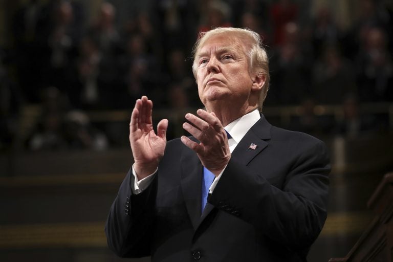 President Donald Trump claps during the State of the Union address in the House chamber of the U.S. Capitol to a joint session of Congress Tuesday, Jan. 30, 2018 in Washington. (Win McNamee/Pool via AP)