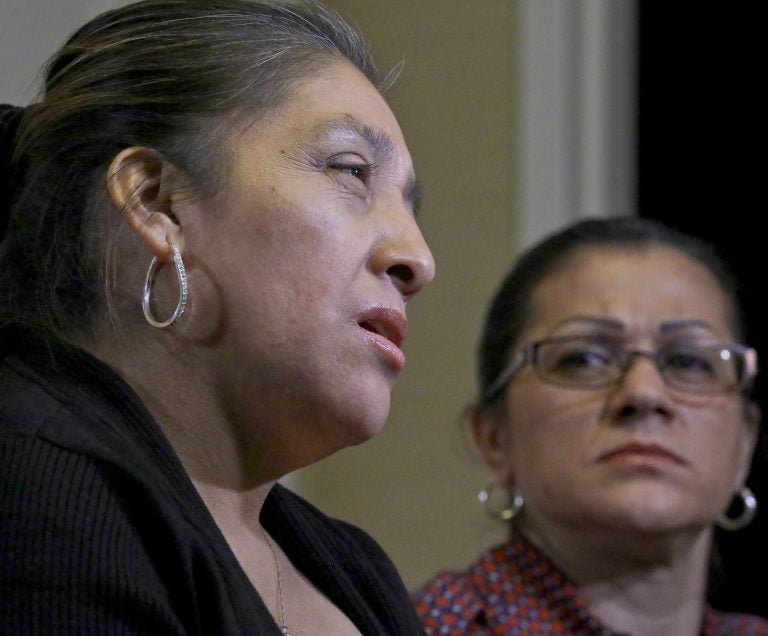 Sandra Diaz, (right), listens as Victorina Morales, (left), recalls her experience working at President Donald Trump's golf resort in Bedminster, N.J., during an interview, Friday Dec. 7, 2018, in New York. (Bebeto Matthews/AP Photo)