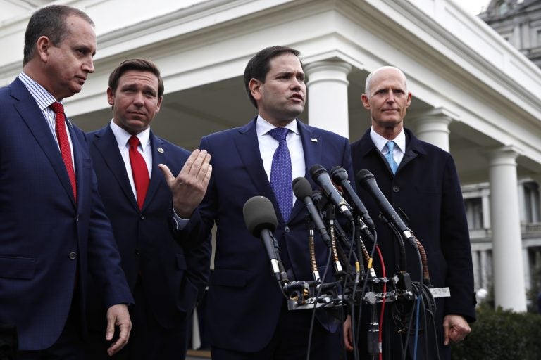 In this Jan. 22, 2019, photo, Rep. Mario Diaz-Balart, R-Fla., (left), Florida Gov. Ron DeSantis, Sen. Marco Rubio, R-Fla., and Sen. Rick Scott, R-Fla., speak to the media after their meeting with President Donald Trump about Venezuela, at the White House in Washington. (Jacquelyn Martin/AP Photo)