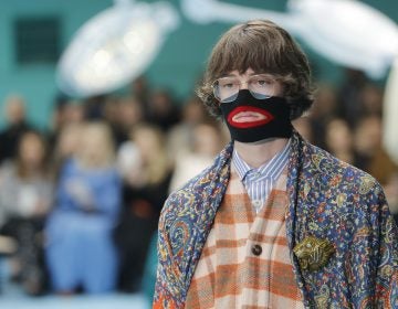 In this Feb. 21, 2018, file photo, a model wears a creation as part of the Gucci women's Fall/Winter 2018-2019 collection, presented during the Milan Fashion Week, in Milan, Italy. Gucci, which designed this face warmer, reminiscent of blackface prompted an instant backlash from the public and forced the company to apologize publicly on Wednesday, Feb. 6, 2019. (Antonio Calanni/AP Photo)