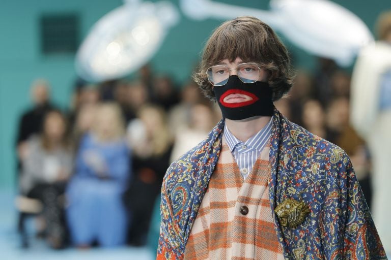 In this Feb. 21, 2018, file photo, a model wears a creation as part of the Gucci women's Fall/Winter 2018-2019 collection, presented during the Milan Fashion Week, in Milan, Italy. Gucci, which designed this face warmer, reminiscent of blackface prompted an instant backlash from the public and forced the company to apologize publicly on Wednesday, Feb. 6, 2019. (Antonio Calanni/AP Photo)