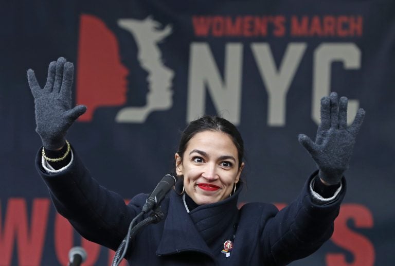 In this Jan. 19, 2019, file photo, U.S. Rep. Alexandria Ocasio-Cortez, D-New York, waves to the crowd after speaking at Women's Unity Rally organized by Women's March NYC at Foley Square in Lower Manhattan in New York. On Thursday, Feb. 14, newly-elected Rep. Alexandria Ocasio-Cortez led a chorus of cheers as Amazon announced it was abandoning plans to build a sought-after headquarters in New York City. Activists berated the online giant for a $3 billion package of tax breaks she said the city could better invest in hiring teachers or fixing the subway. (Kathy Willens/AP Photo, File)