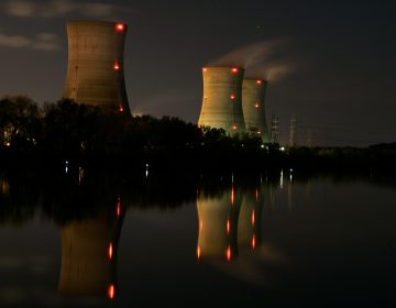 In this file photo from Nov. 2, 2006, cooling towers of the Three Mile Island nuclear power plant are reflected in the Susquehanna River in this time exposure photograph in Middletown, Pa. (Carolyn Kaster/AP Photo)