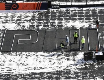 Workers continue preparations ahead of the NHL Winter Classic hockey game between the Pittsburgh Penguins and Philadelphia Flyers, in Philadelphia, Thursday, Feb. 21, 2019. (Matt Rourke/AP Photo)