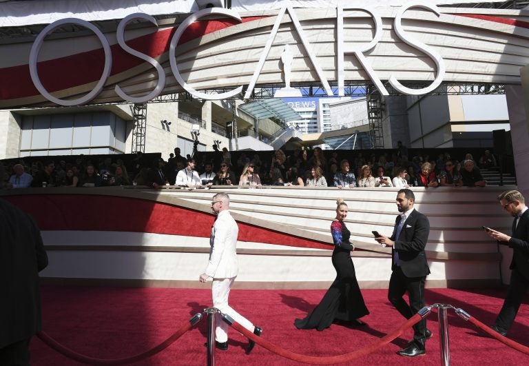 File photo: Media walk on the red carpet before the Oscars on Sunday, Feb. 24, 2019, at the Dolby Theatre in Los Angeles. (Photo by Jordan Strauss/Invision/AP)