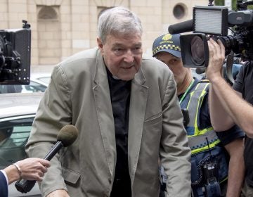 Cardinal George Pell arrives at the County Court in Melbourne, Australia, Tuesday. The most senior Catholic cleric ever charged with child sex abuse has been convicted of molesting two choirboys moments after celebrating Mass, dealing a new blow to the Catholic hierarchy's credibility after a year of global revelations of abuse and cover-up. (AP Photo/Andy Brownbill)