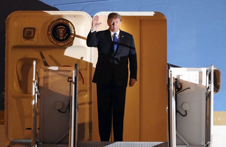 U.S President Donald Trump arrives at Noi Bai Airport before a summit with North Korean leader Kim Jong Un, Tuesday, Feb. 26, 2019, in Hanoi. (Kham/Pool photo via AP)