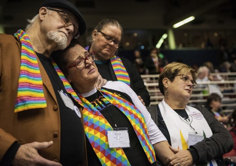 Ed Rowe, (left), Rebecca Wilson, Robin Hager and Jill Zundel, react to the defeat of a proposal that would allow LGBT clergy and same-sex marriage within the United Methodist Church at the denomination’s 2019 Special Session of the General Conference in St. Louis, Mo., Tuesday, Feb. 26, 2019. (Sid Hastings/AP Photo)