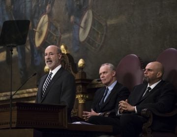 Democratic Gov. Tom Wolf, left, delivers his budget address for the 2019-20 fiscal year to a joint session of the Pennsylvania House and Senate in Harrisburg, Pa., Tuesday, Feb. 5, 2019. House Speaker Mike Turzai, R-Allegheny, is at the center, and Lt. Gov. John Fetterman is at the right.