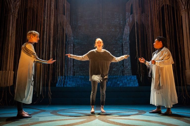 Clare O’Malley (center) delivers a sweet, searing Joan who dazzles all with her confidence and determination in Delaware Theatre Company's production of 