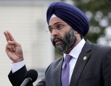 New Jersey Attorney General Gurbir Grewal speaks during a news conference, Wednesday, Aug. 1, 2018, in Newark, N.J. Grewal is among 16 state attorneys general suing the Trump administration over the president's declaration of a national emergency to secure funding for a border wall. (AP Photo/Julio Cortez)