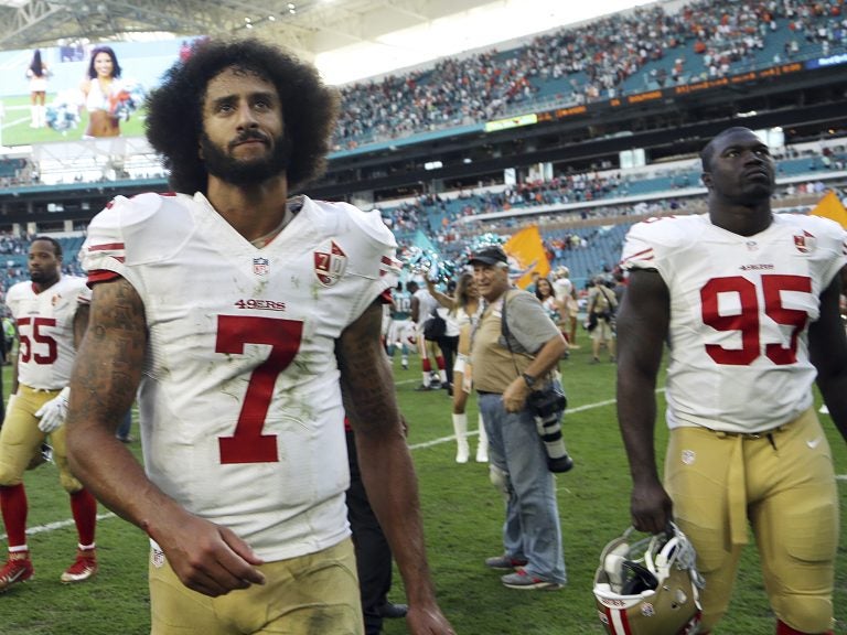 Former San Francisco 49ers quarterback Colin Kaepernick (7), shown here in 2016, has reached an agreement with the NFL over his allegations of collusion by teams. (Lynne Sladky/AP)