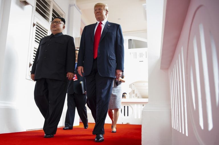 North Korea's leader Kim Jong Un and President Trump walk together at a resort on Sentosa Island in Singapore on June 12, 2018. (Evan Vucci/AP Photo)