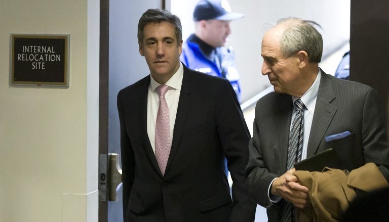 Michael Cohen (left), President Trump's former lawyer, arrives to testify before a closed hearing of the Senate intelligence committee, with his lawyer Lanny Davis on Tuesday. (Alex Brandon/AP)