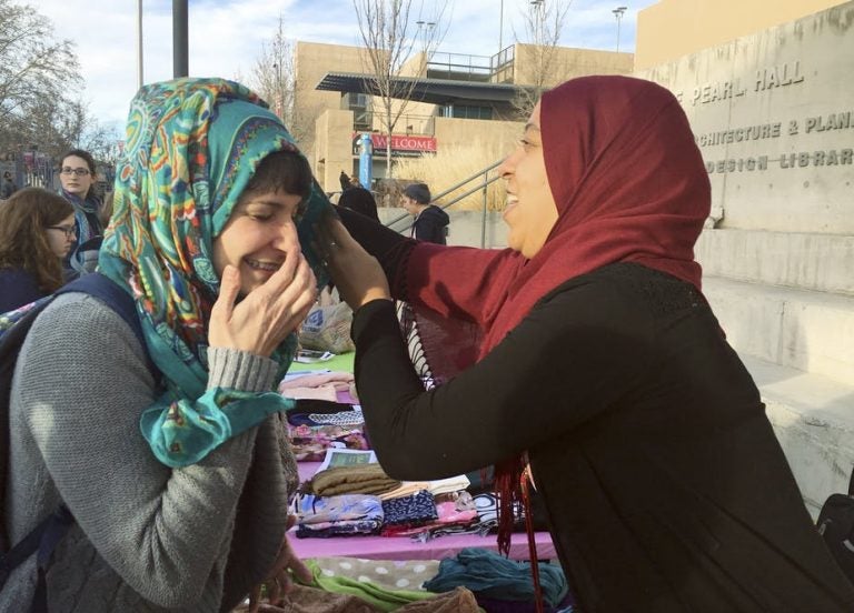 A student on the campus of the University of New Mexico in Albuquerque, trying out the hijab on World Hijab Day, 2017. (Russell Contreras/AP Photo)