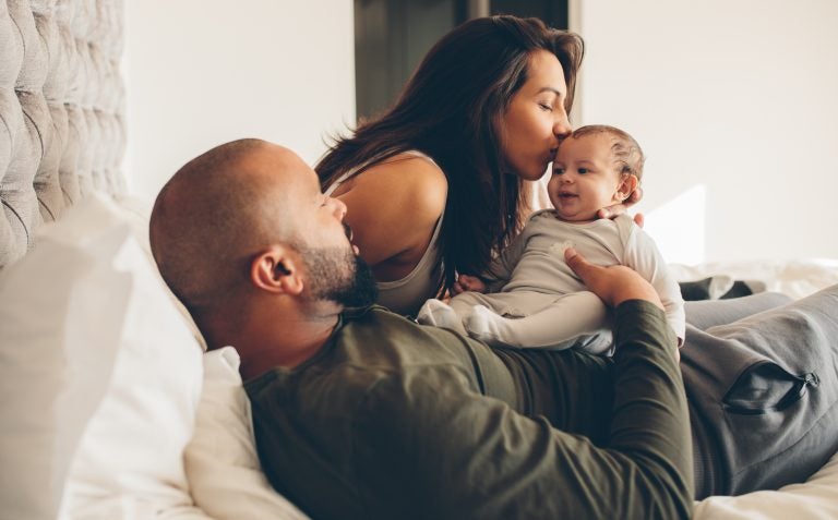 Protected time for new families could pay health dividends later. (Jacob Lund/Shutterstock)