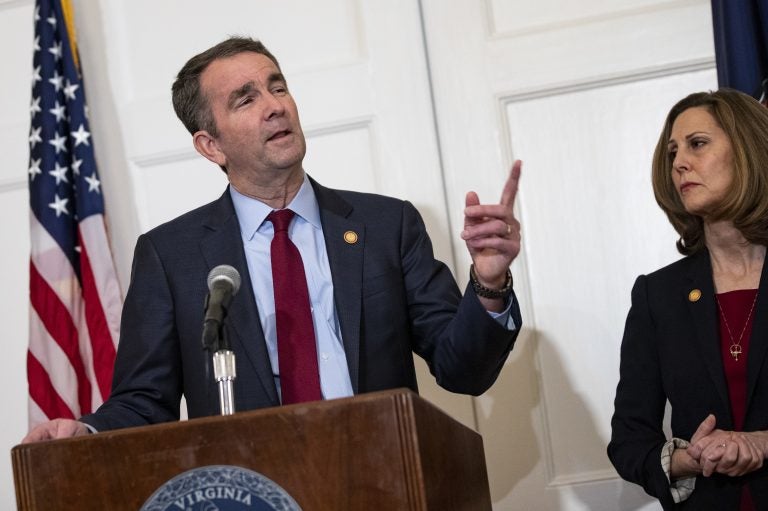 Virginia Gov. Ralph Northam, with his wife, Pam, speaks with reporters at a news conference Saturday in Richmond, Va. Virginia Gov. Ralph Northam, with his wife, Pam, speaks with reporters at a news conference Saturday in Richmond, Va.