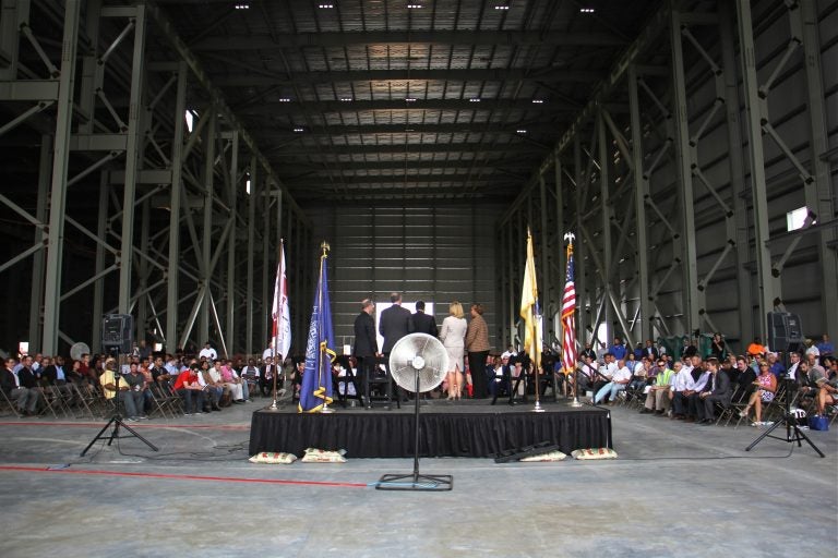 State and local government officials attend a ceremony for the raising of the final steel beam at Holtec International. on July 8, 2016. The company got $260 million in tax incentives to build its manufacturing plant in Camden.