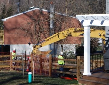 Crews worked on Monday Jan. 21 to stabilize a new sinkhole that opened up at Lisa Drive, a suburban development in West Whiteland Township, Chester County where Sunoco operates its Mariner East pipelines. (Jon Hurdle/StateImpact Pennsylvania)