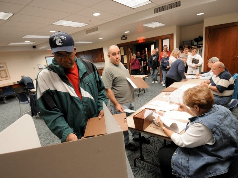 Commissioners in Sandusky, Ohio, have voted to make Election Day a city holiday, in place of Columbus Day. Sandusky resident Moses Croom is seen here voting at a polling station at a local library in November 2008.
(Jason Werling/Sandusky Register)