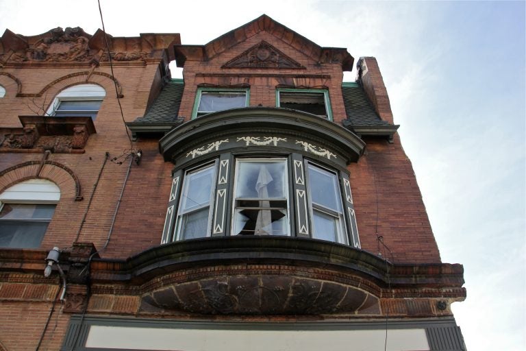 The former home of artist Dox Thrash is in a state of disrepair at the corner of Cecil B. Moore Avenue and 24th Street. (Emma Lee/WHYY)