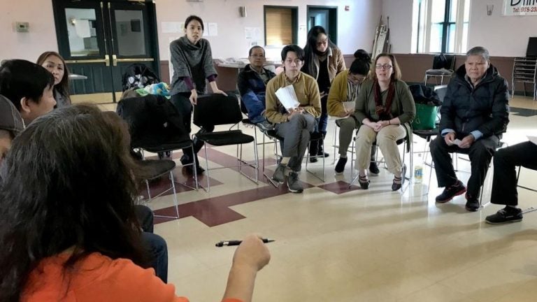 At a public forum at VietAID in Dorchester, Mass., Vietnamese immigrants learn more about changes to immigration policies under President Trump. (Shannon Dooling/WBUR)