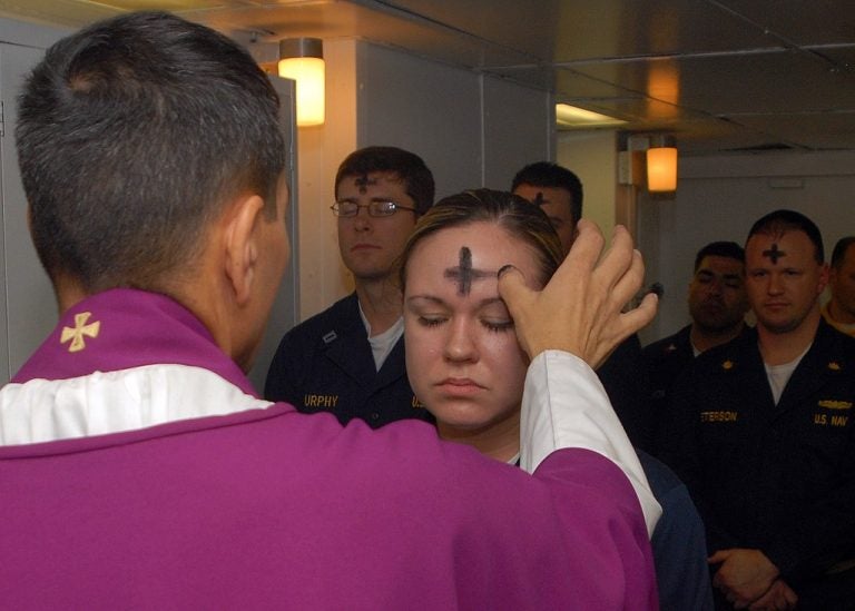 US Navy employees receive the sacramental ashes during an Ash Wednesday celebration (U.S. Navy photo by Mass Communication Specialist 3rd Class Brian May/Public domain)