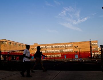 Students head to school at the now-shuttered Germantown High School. (Brad Larrison for WHYY)